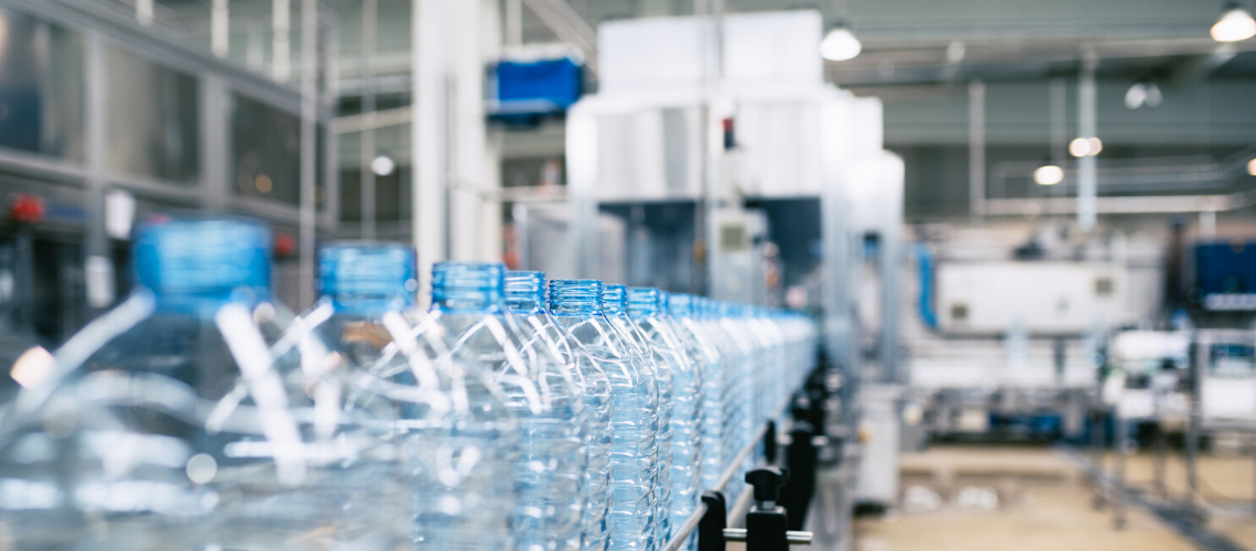 Plastic bottles being manufactured in a factory